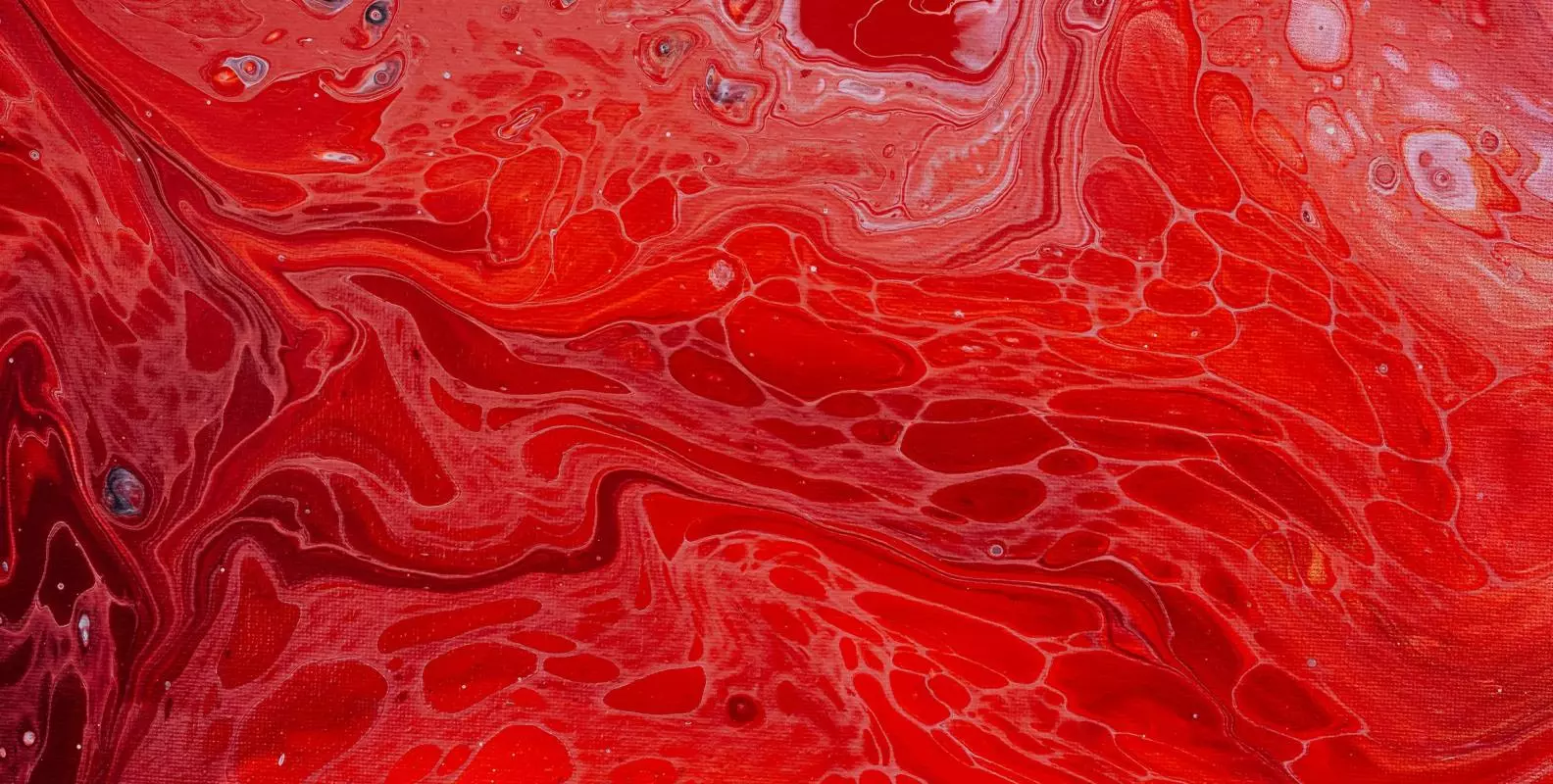 Pattern of swirling red oil 