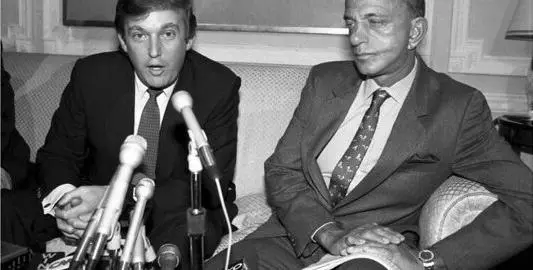 Black and white image of Trump and Cohn 