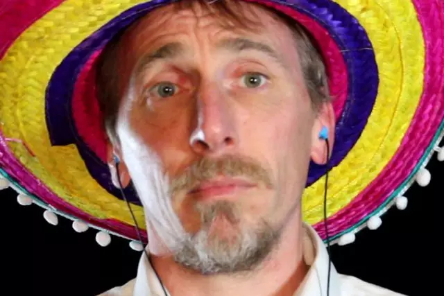 John McCraw wears a multicoloured sombrero.
