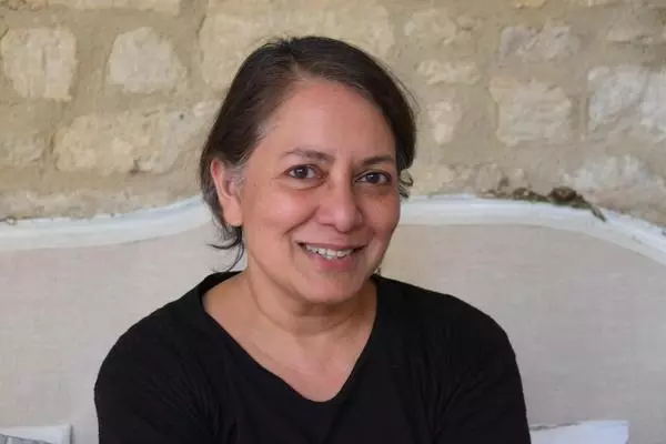 Photo of Sunetra Gupta smiling.